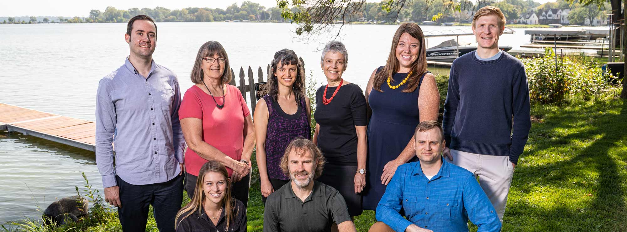 Photo of the designCraft team in front of Monona Bay