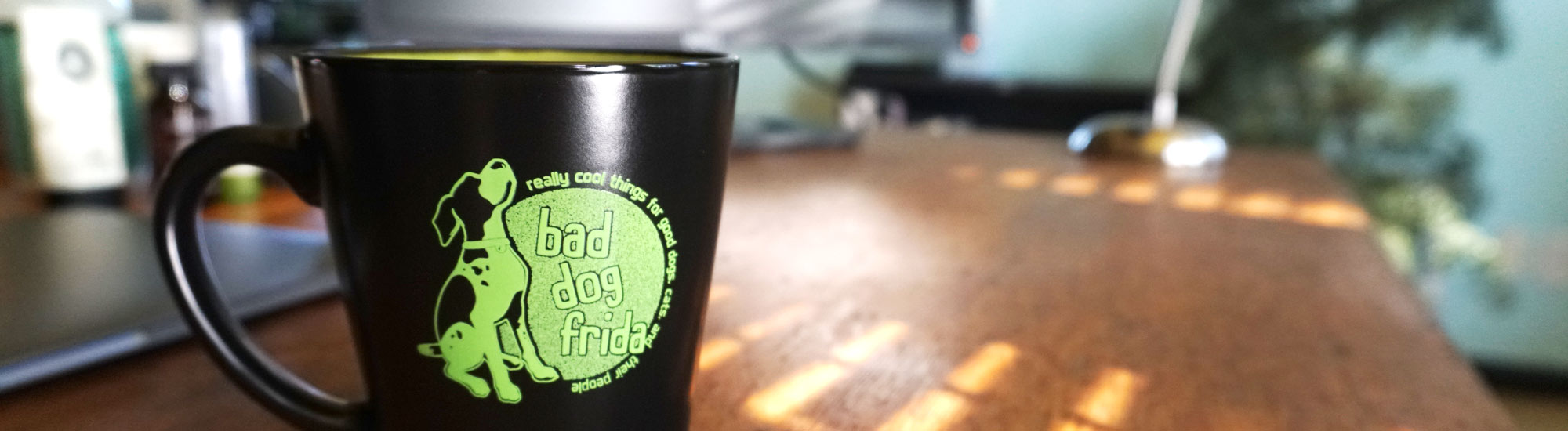 Photo of Bad Dog Frida logo mug on desk