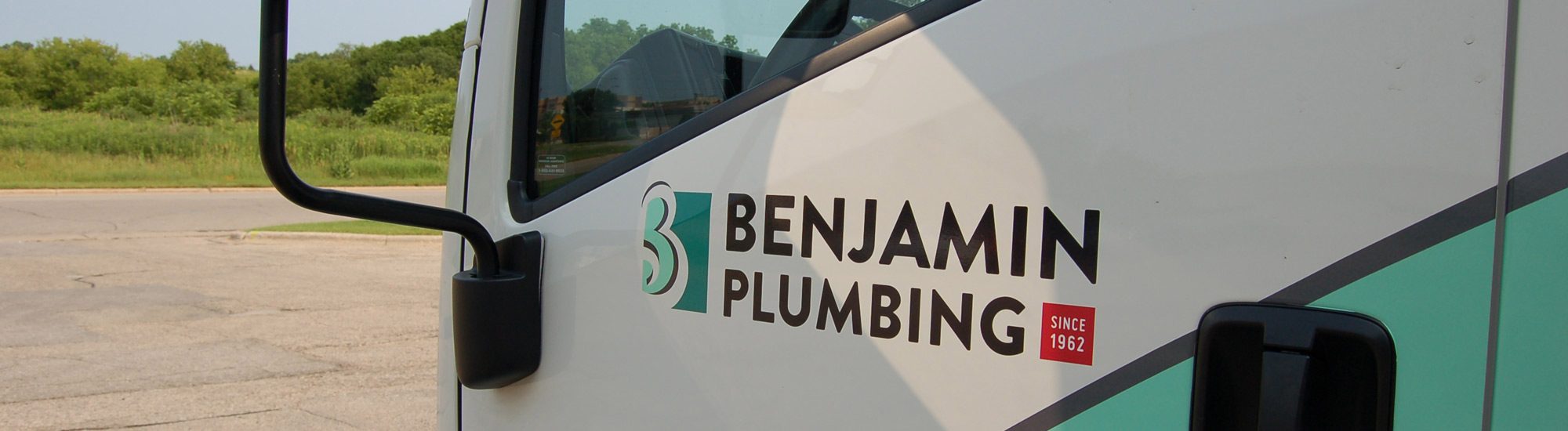 Photo of Benjamin Plumbing logo on truck